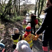 Children enjoying a Forest School session at Little Acorns Nursery