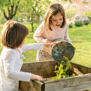 Step 2 is to tip the leaves and suitable kitchen scraps into your compost heap, bin or tub. Children will enjoy sprinkling, layering, and patting it all down.